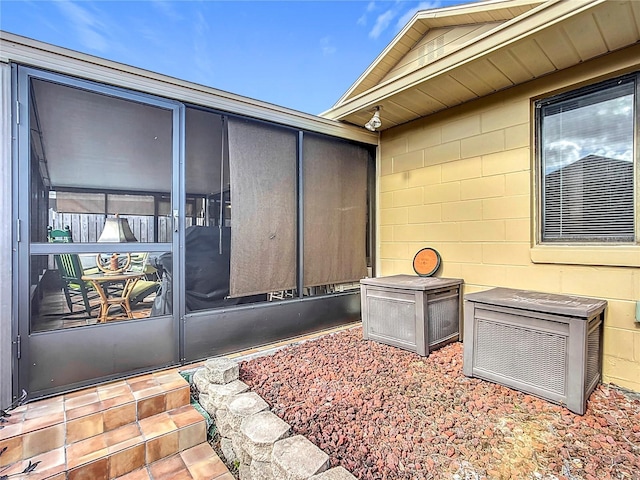 exterior space featuring a sunroom