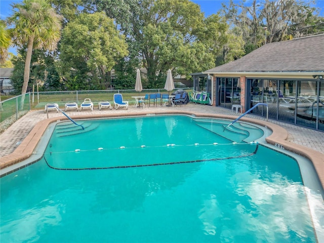 view of swimming pool featuring a patio area