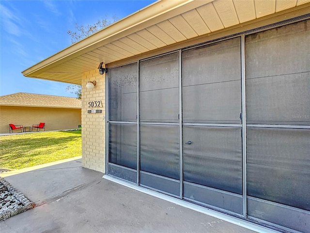 doorway to property featuring a yard