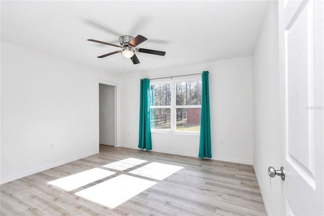 unfurnished room with ceiling fan and light hardwood / wood-style flooring