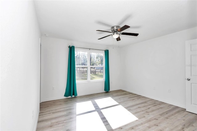 unfurnished room featuring ceiling fan and light hardwood / wood-style floors