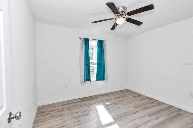 unfurnished room with ceiling fan and light hardwood / wood-style flooring