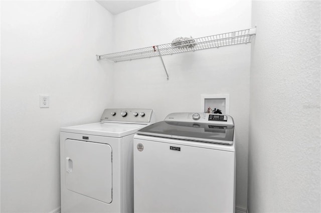 laundry room featuring washer and clothes dryer