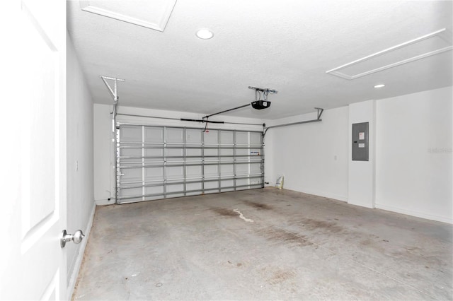 garage featuring electric panel and a garage door opener