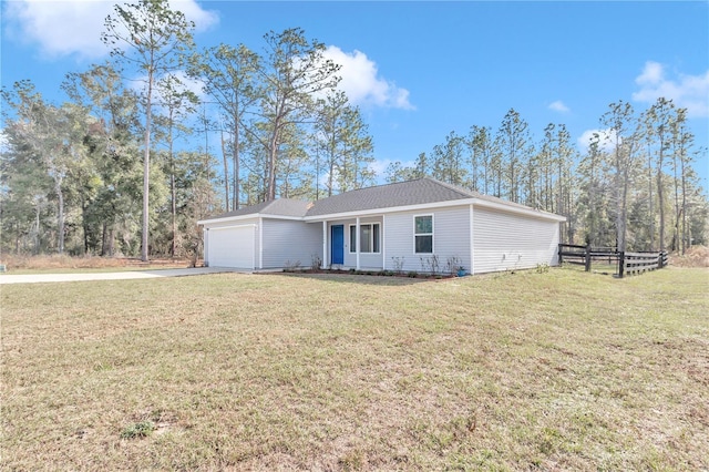 view of front of property featuring a garage and a front lawn