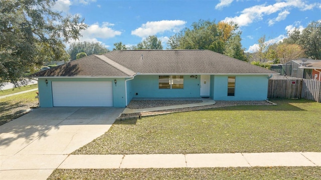 single story home featuring a front yard and a garage