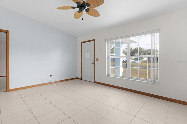 tiled empty room with ceiling fan