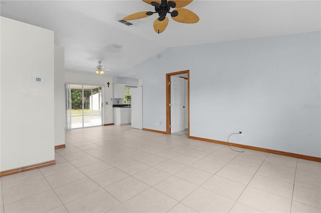 interior space with light tile patterned floors, ceiling fan, and lofted ceiling