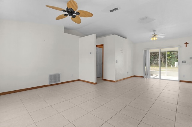 unfurnished room with light tile patterned floors, vaulted ceiling, and ceiling fan