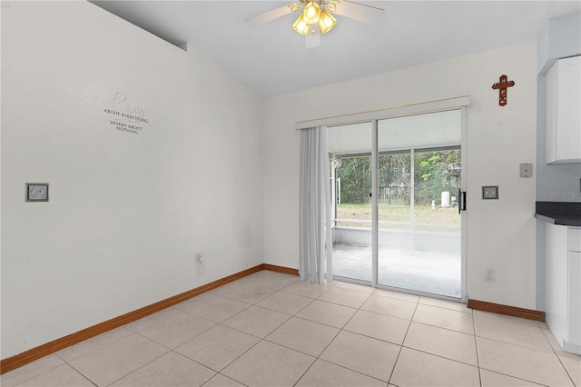 unfurnished room featuring ceiling fan and light tile patterned floors