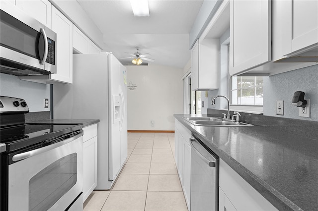 kitchen with white cabinetry, sink, ceiling fan, light tile patterned flooring, and appliances with stainless steel finishes