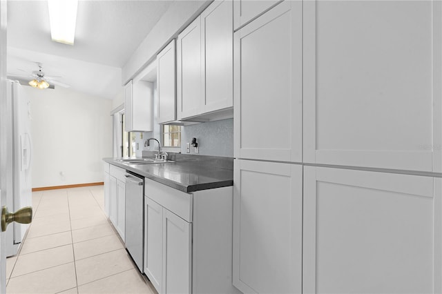 kitchen with dishwasher, white refrigerator, sink, ceiling fan, and light tile patterned floors