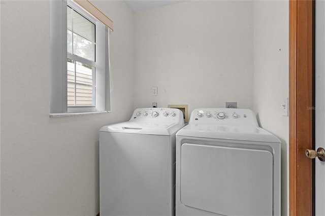 clothes washing area featuring washer and dryer