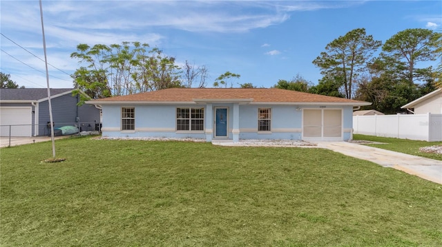 ranch-style home featuring a front yard and a garage