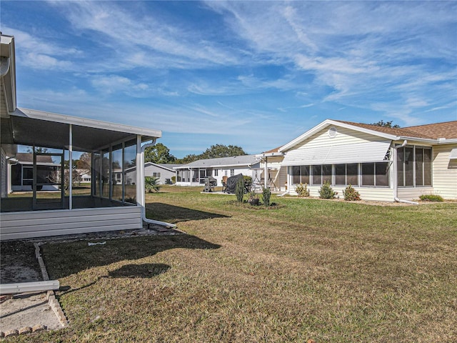 view of yard with a sunroom