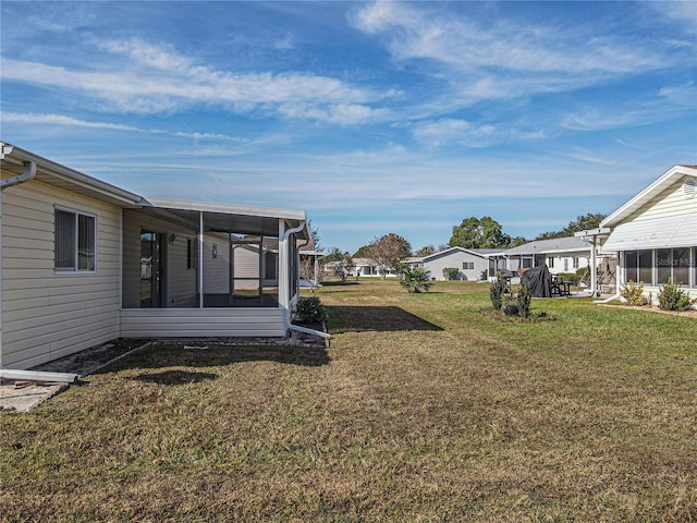 view of yard with a sunroom