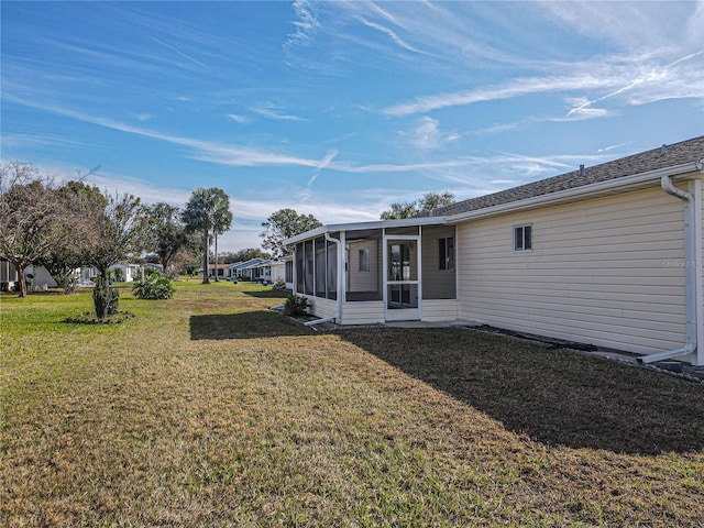 view of yard featuring a sunroom