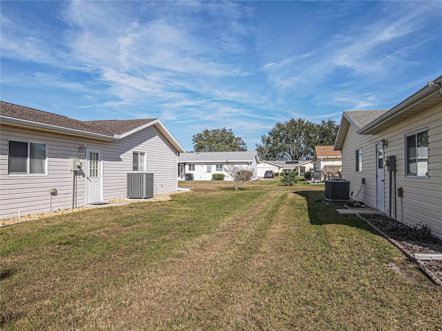 view of yard with central AC unit