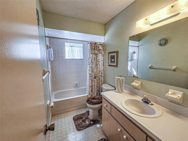 full bathroom featuring vanity, toilet, shower / bath combo with shower curtain, and a textured ceiling