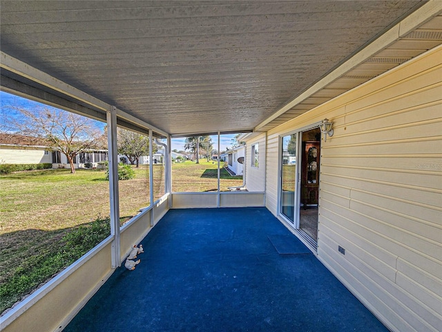 unfurnished sunroom featuring wood ceiling