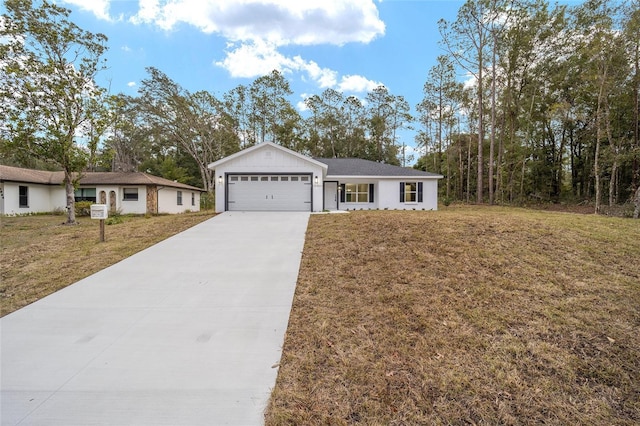 ranch-style house featuring a garage and a front yard