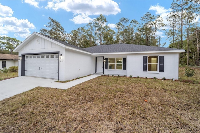 ranch-style house featuring a garage and a front lawn