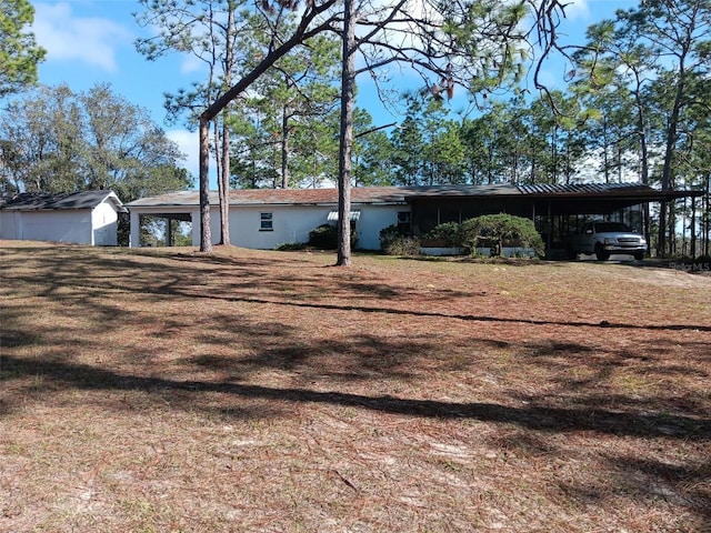 view of front of home with a carport