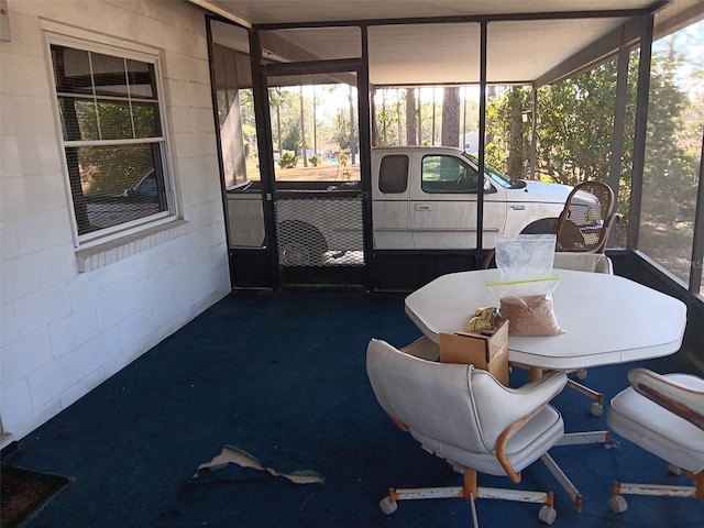 sunroom / solarium featuring plenty of natural light