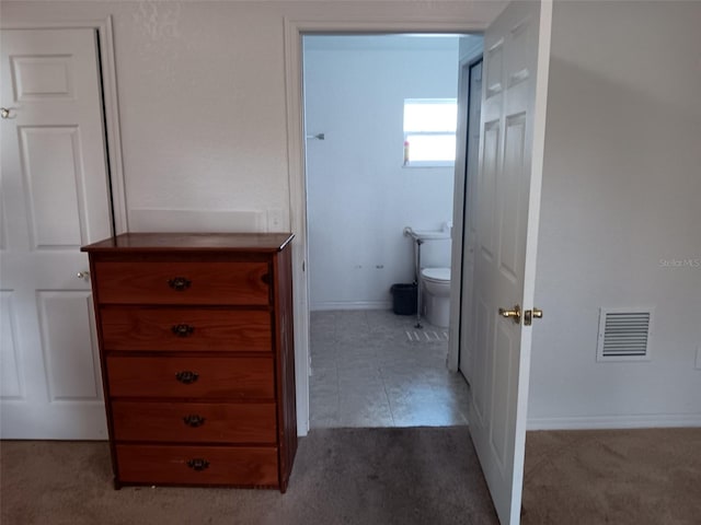 hallway featuring light carpet