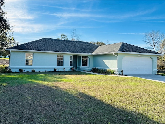 single story home with a front yard and a garage