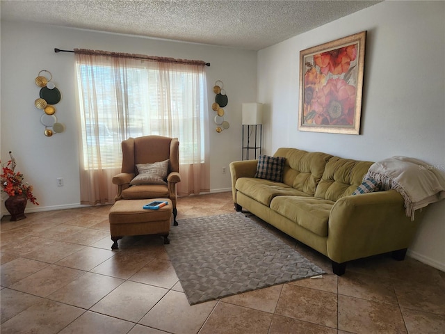 living room featuring light tile patterned floors and a textured ceiling