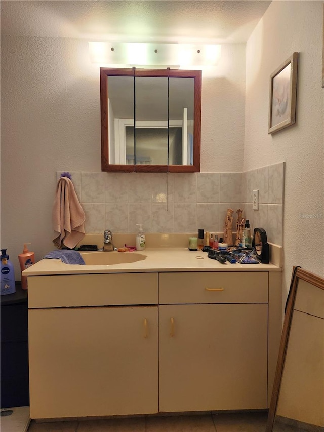 bathroom featuring decorative backsplash and vanity