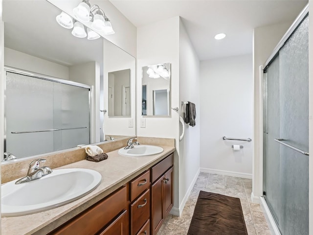 bathroom with vanity, tile patterned flooring, and walk in shower