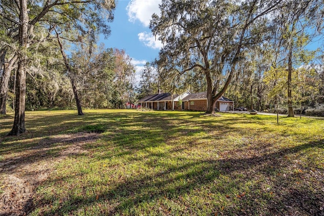 view of yard featuring a garage