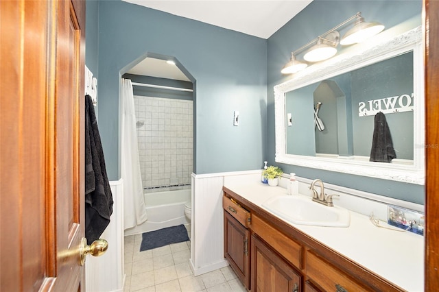 full bathroom featuring tile patterned floors, shower / bath combo, toilet, and vanity