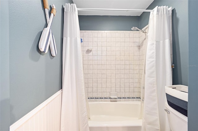 bathroom featuring shower / bath combination with curtain