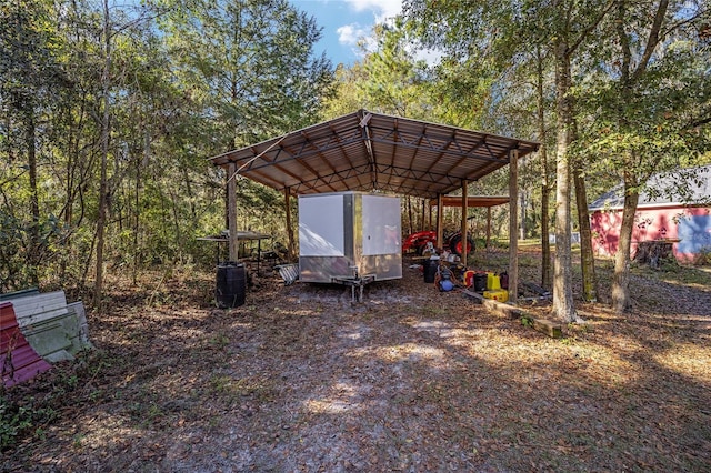 view of vehicle parking featuring a carport