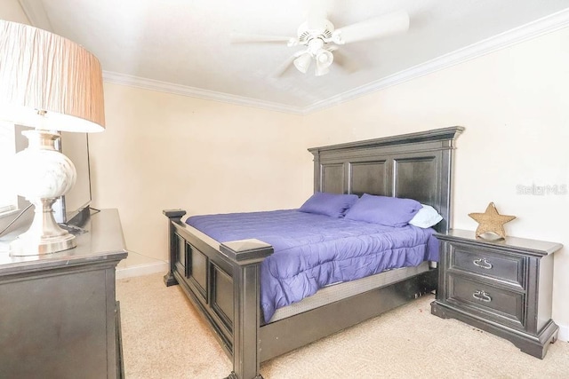 bedroom with ceiling fan, ornamental molding, and light carpet