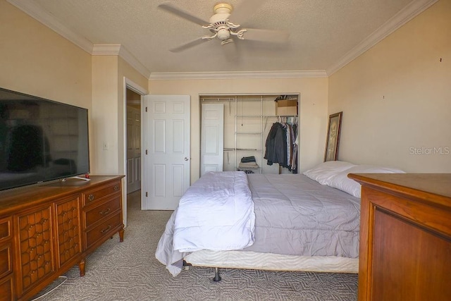 carpeted bedroom with ceiling fan, ornamental molding, a closet, and a textured ceiling