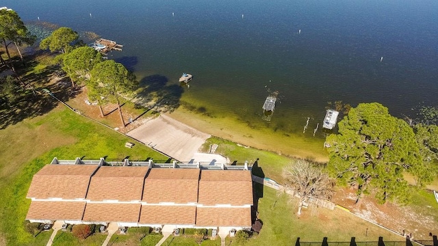 birds eye view of property with a water view