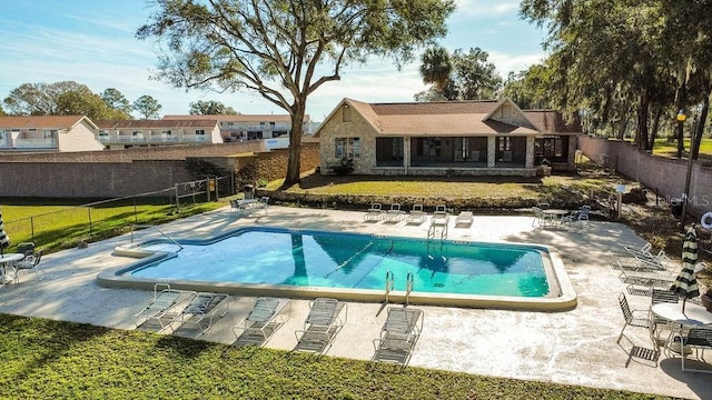 view of swimming pool featuring a patio area