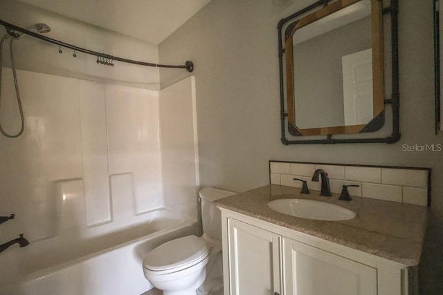 full bathroom featuring tasteful backsplash, vanity, toilet, and  shower combination