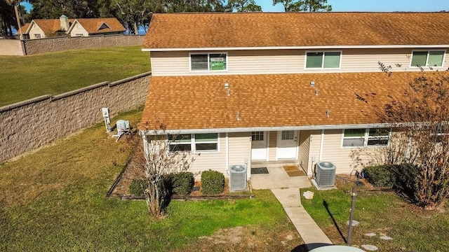 back of house featuring a patio, central AC, and a lawn