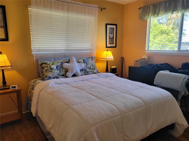 bedroom with hardwood / wood-style floors