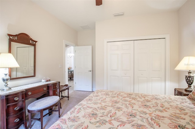 bedroom featuring carpet, a closet, visible vents, and ceiling fan