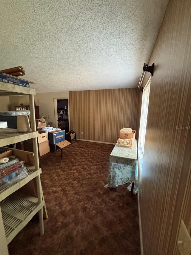 carpeted bedroom featuring a textured ceiling