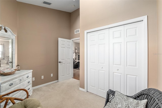 living area featuring light colored carpet