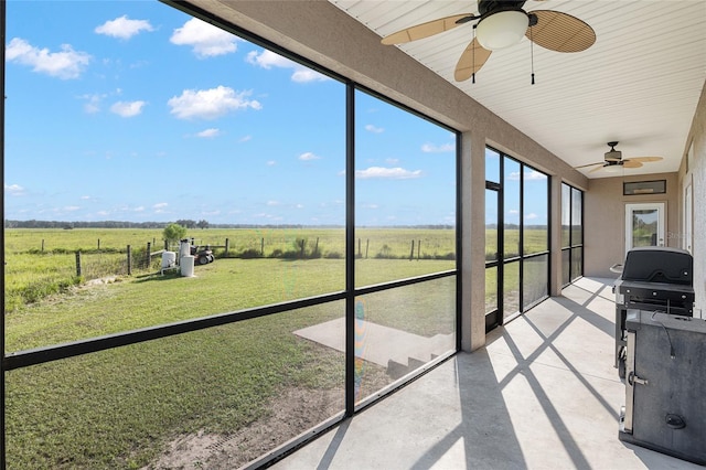 sunroom / solarium featuring a rural view