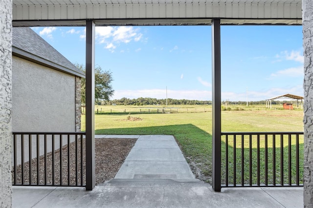 view of yard with a rural view