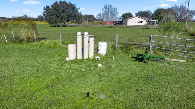 view of yard with a rural view